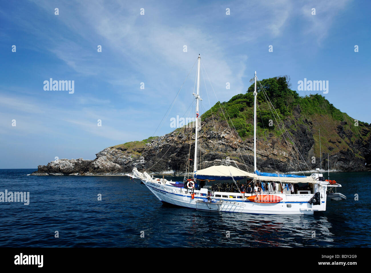 Motor sailship in front of rocky island, Similan Islands, Phuket, Thailand, Asia, Andaman Sea, Indian Ocean Stock Photo
