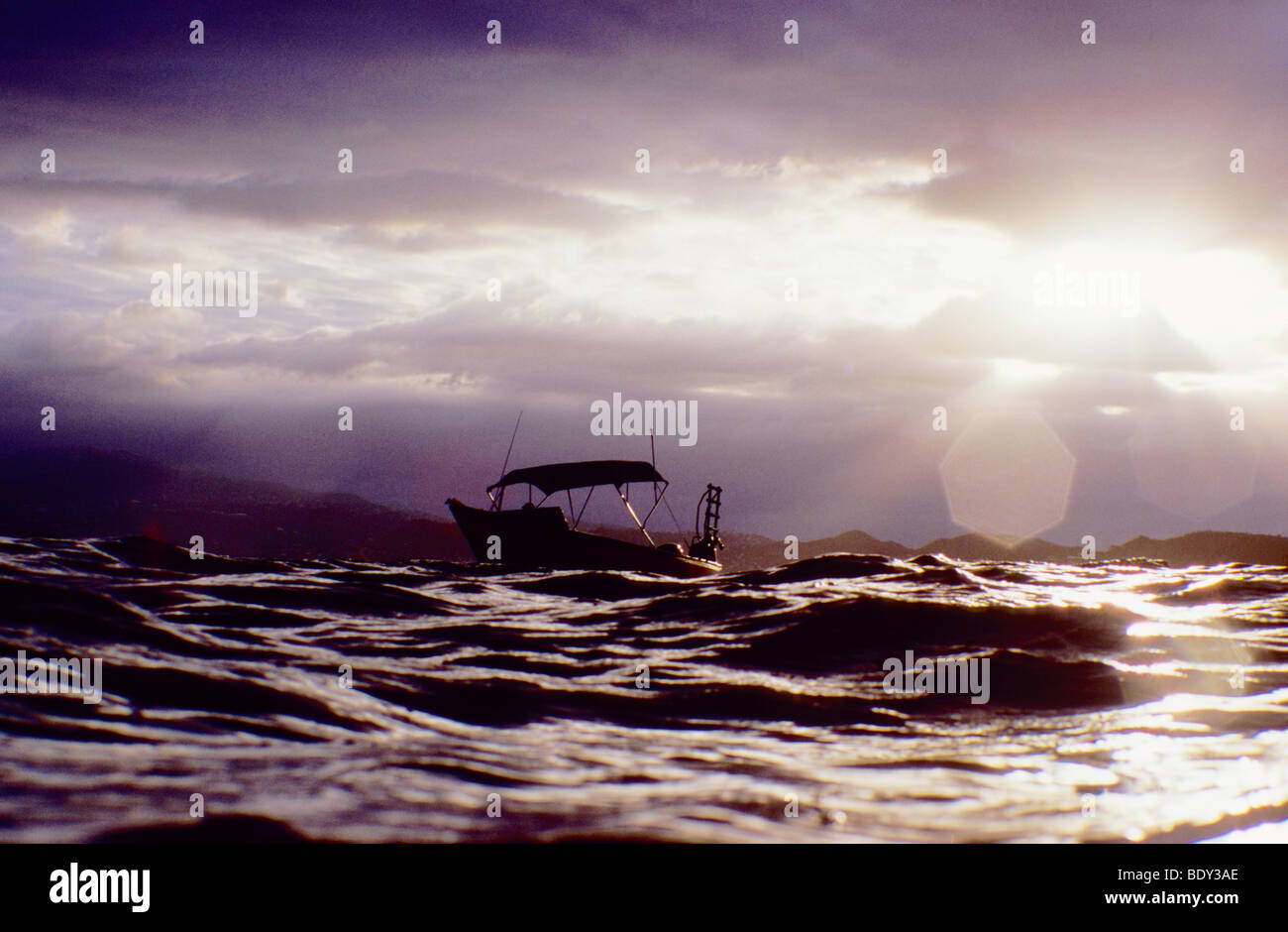 Scuba diving boat awaits the return of the scuba divers, diving below