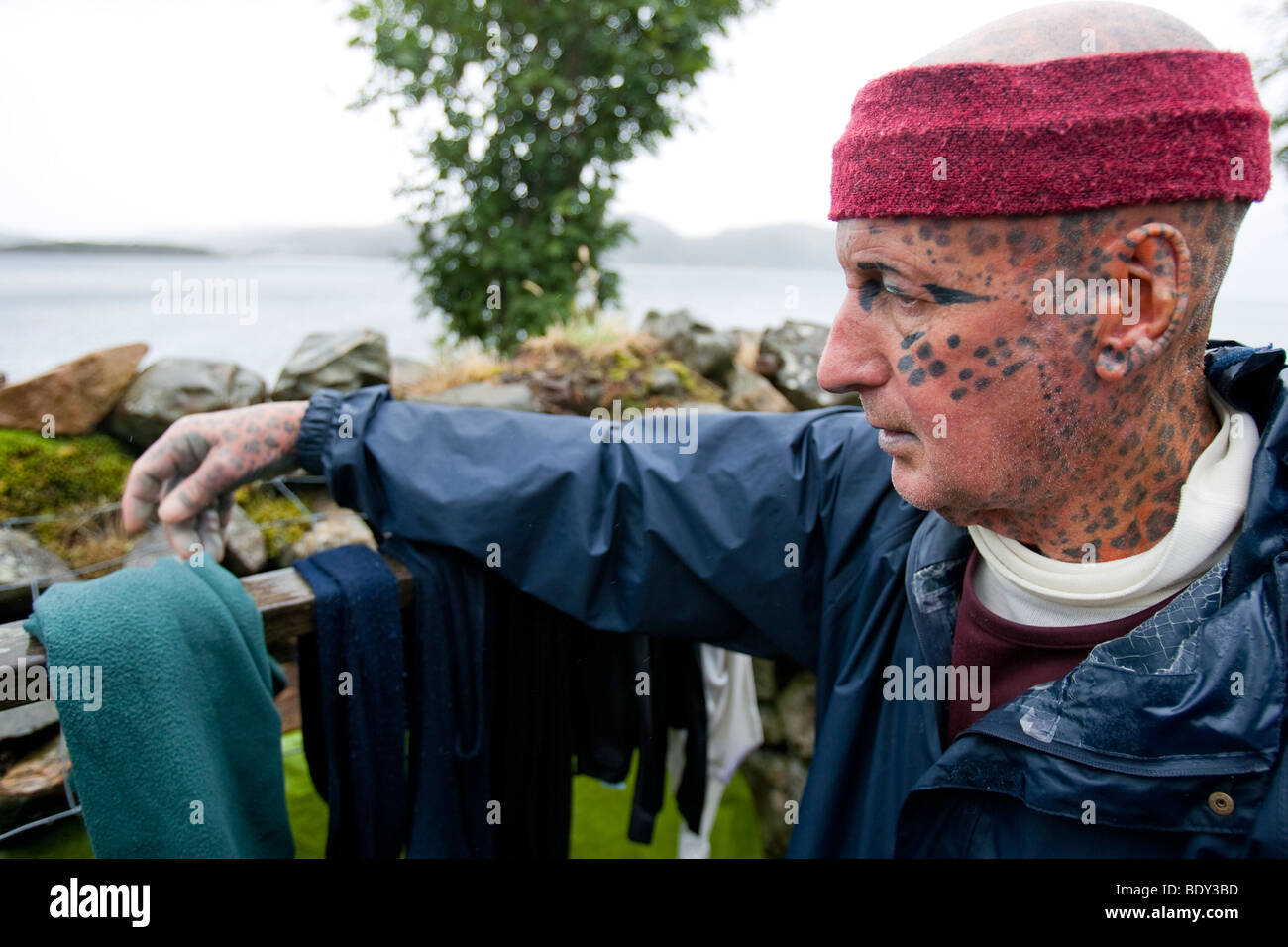 Tom Leppard the "Leopard Man of Skye" is a hermit and the world's most tattooed man, with tattoos covering over 99% of his body. Stock Photo