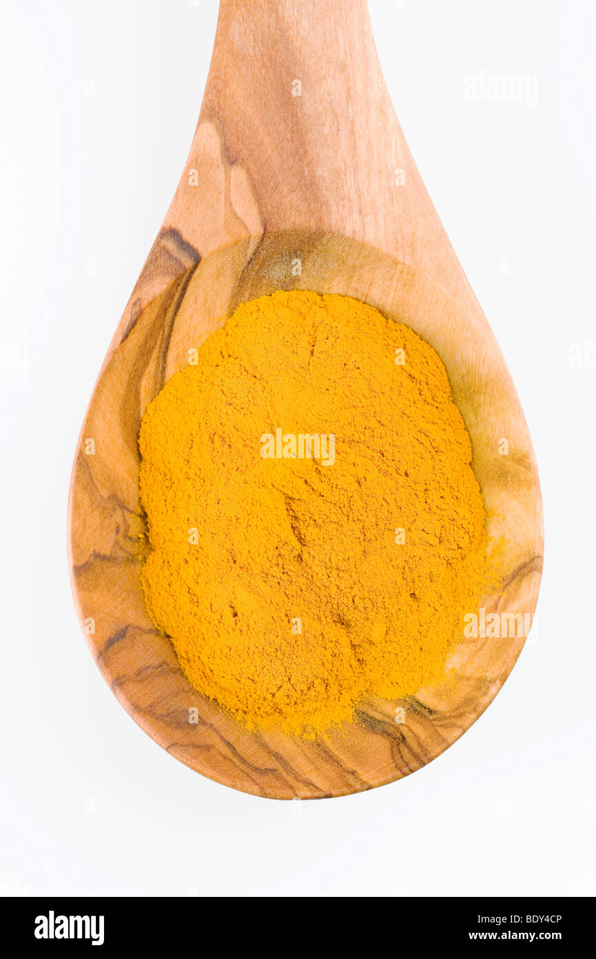 Turmeric (Curcuma longa, domestica) on a spoon of olive wood Stock Photo