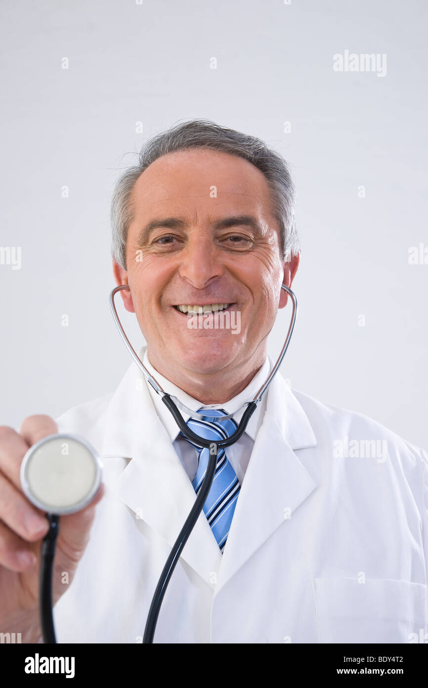 Doctor holds stethoscope head hi-res stock photography and images - Alamy