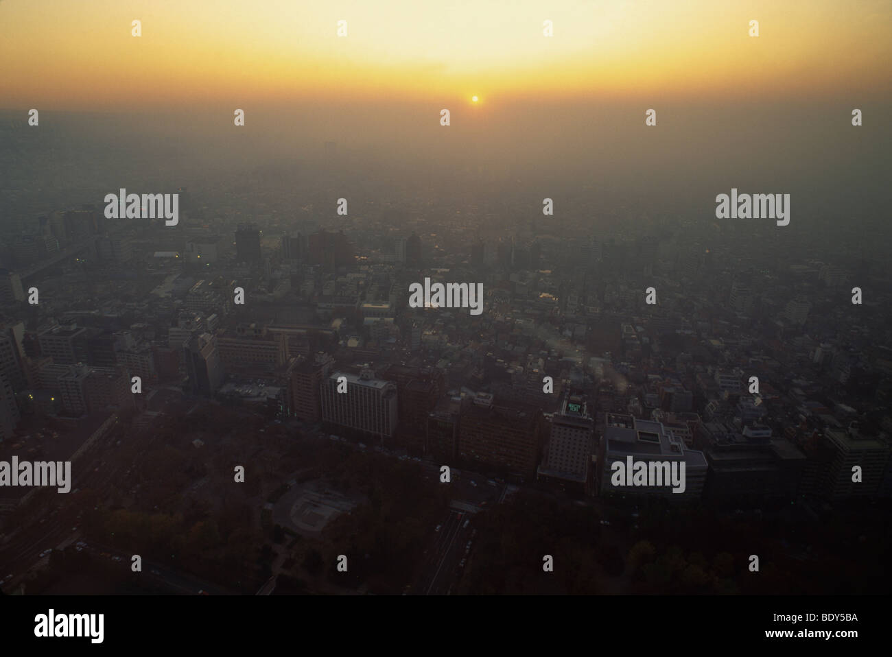Aerial view of smog at sunset over west Shinjuku district, Tokyo, Japan Stock Photo