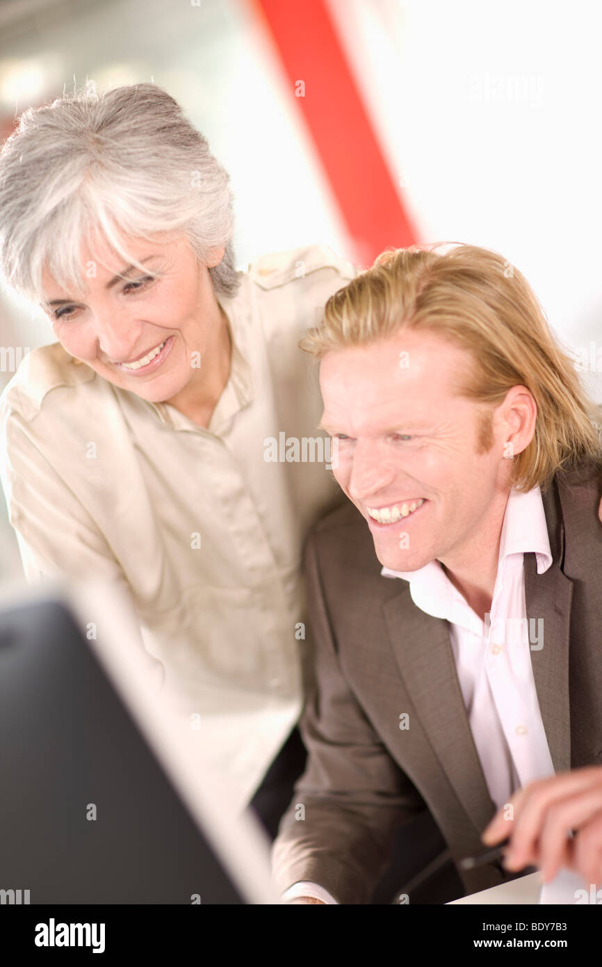 woman and man working in an office Stock Photo - Alamy