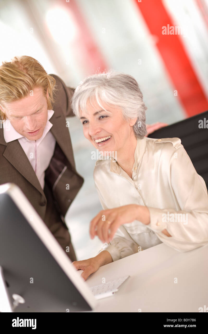 woman and man working in an office Stock Photo - Alamy
