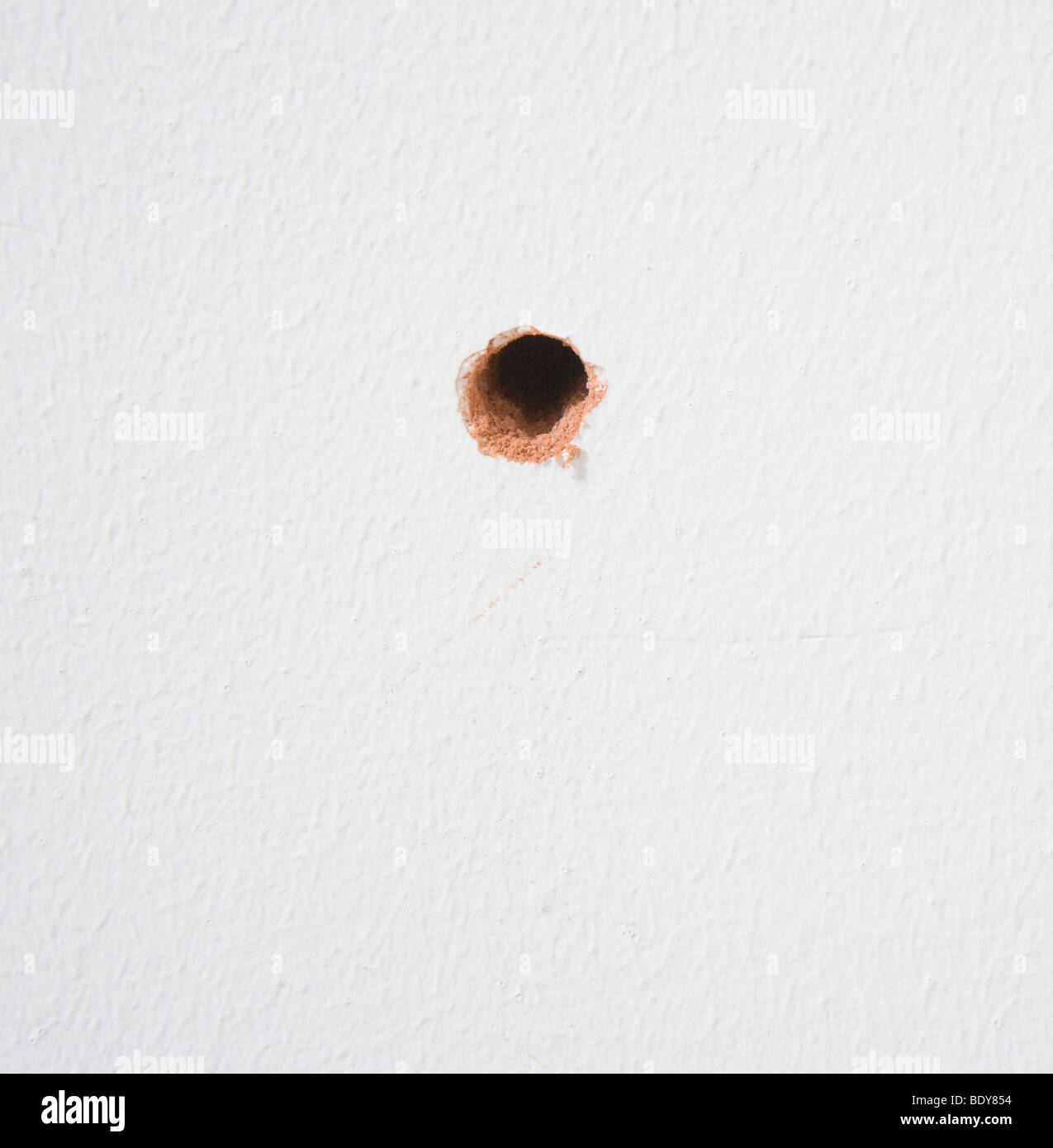drilled hole in wall Stock Photo Alamy