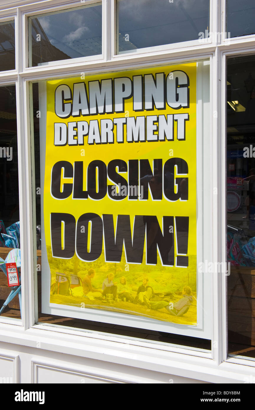 CAMPING DEPARTMENT CLOSING DOWN sale poster in window of outdoor shop