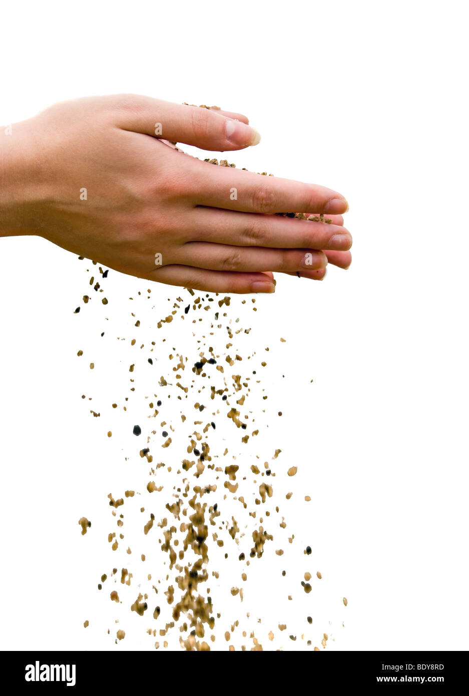Time passing concept. Falling out sand from human hands. Isolated Stock Photo
