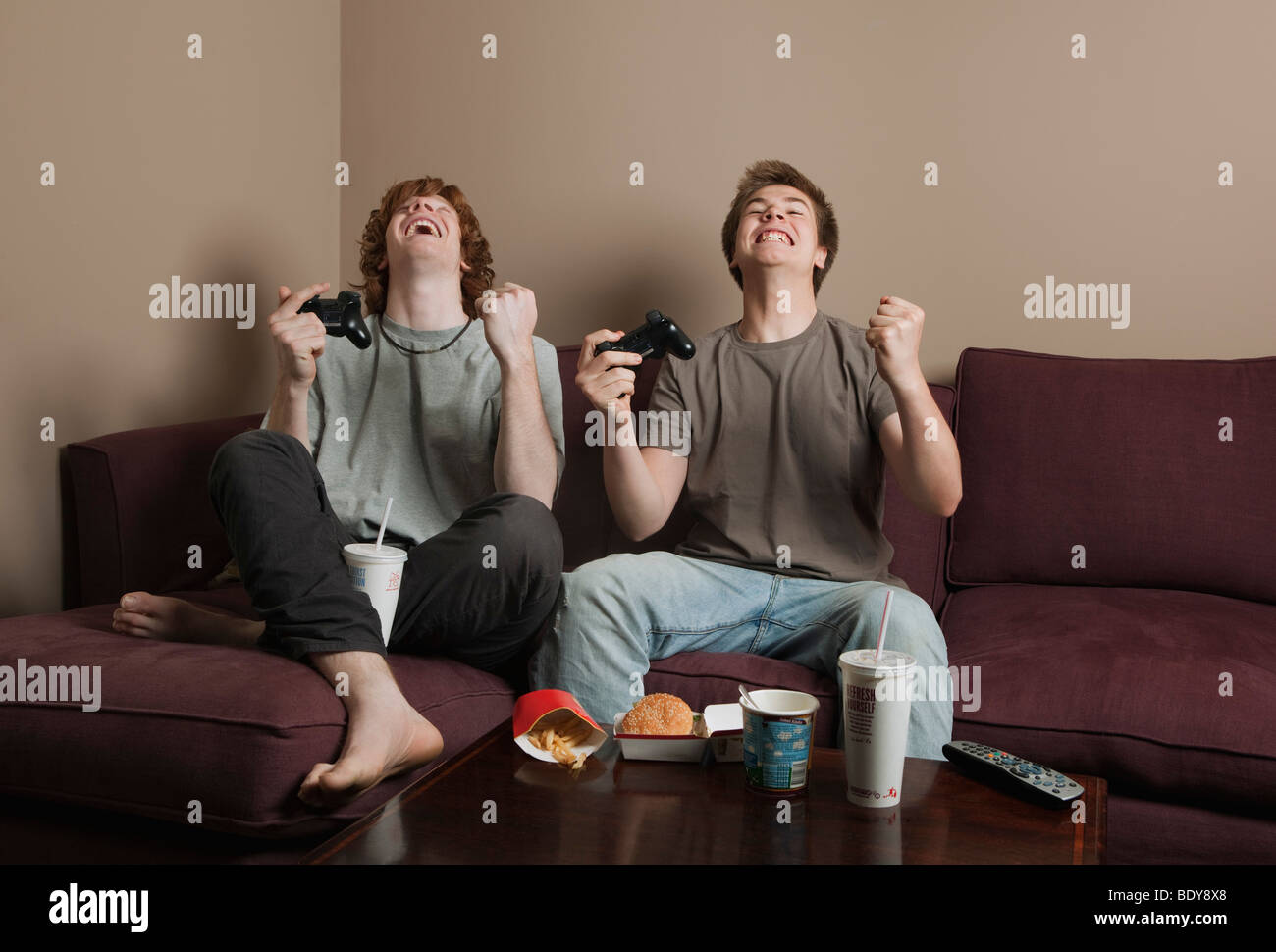 Boys playing video game Stock Photo