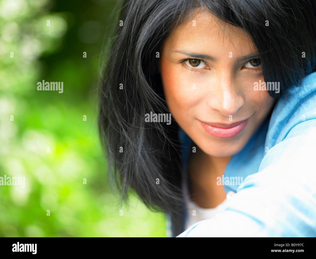 Woman looking at camera, outdoors Stock Photo