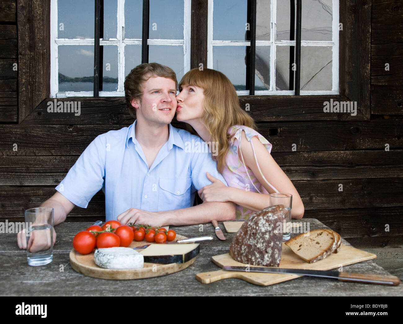 couple eating, kissing outdoors Stock Photo Alamy