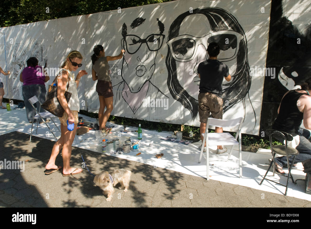 Artists work on their canvases at the Howl! Festival's "Art Around the Park" around Tompkins Square Park in New York Stock Photo