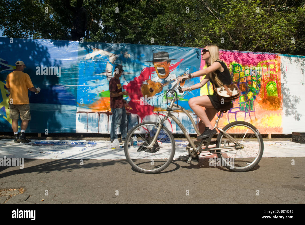 Artists work on their canvases at the Howl! Festival's 'Art Around the Park' around Tompkins Square Park in New York Stock Photo