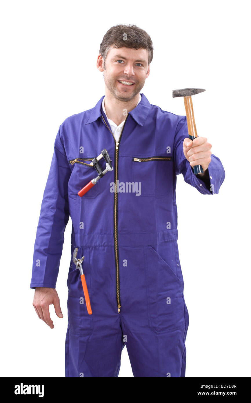 Workman with tool wearing a boiler suit Stock Photo