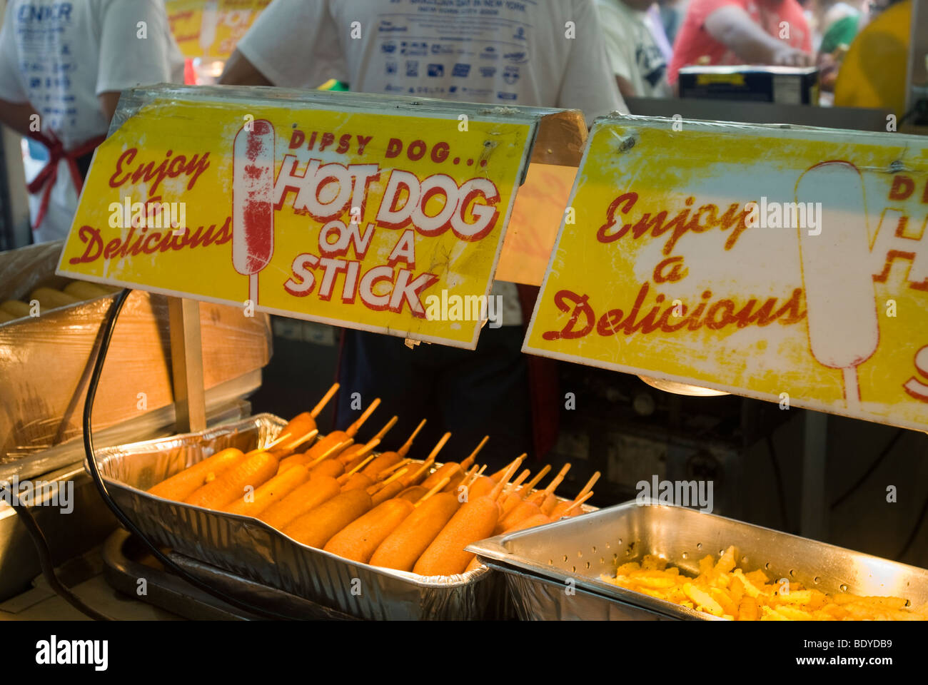 A vendor at a street fair in New York sells corn dogs on Sunday