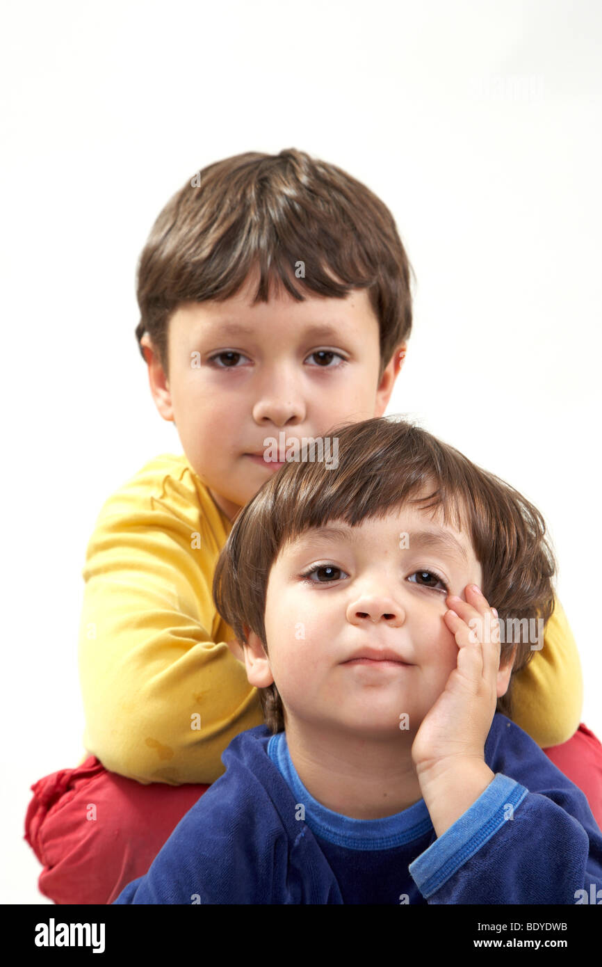 Six-year-old boy with his three-year-old sister Stock Photo