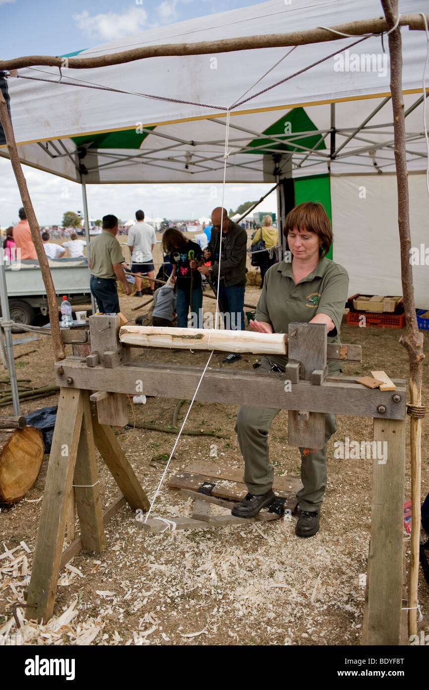A demonstration of a traditional woodworking pole lathe at a country