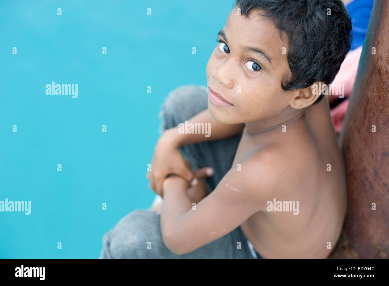 Marshallese boy waiting on the pier at Jabor, Jaluit Atoll, Marshall