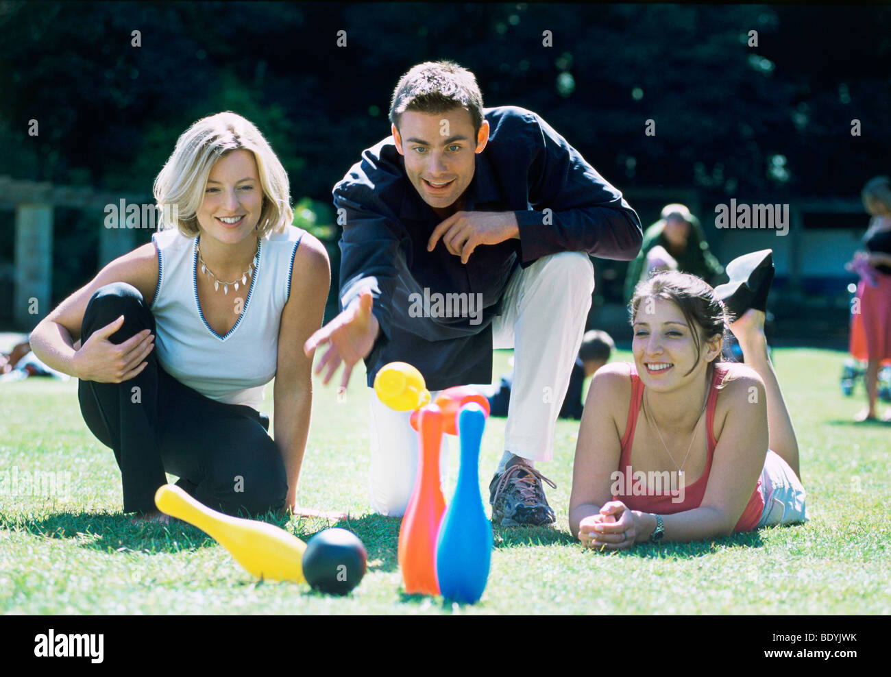 A group of friends playing skittles Stock Photo