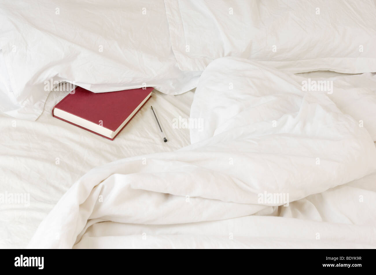 diary tucked under pillow Stock Photo