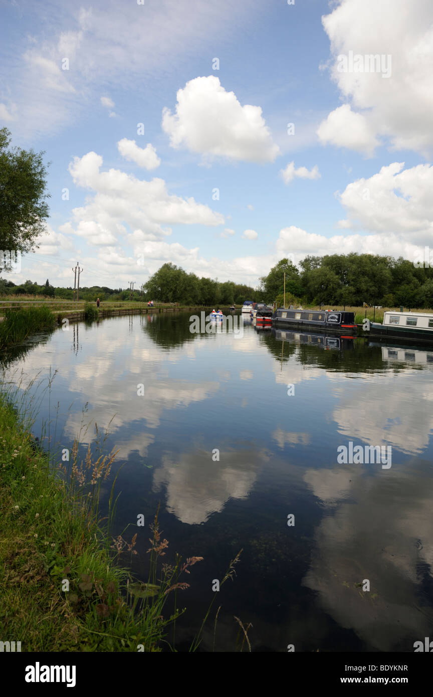 Houseboats and reflections of clouds in the river Lea at Broxbourne