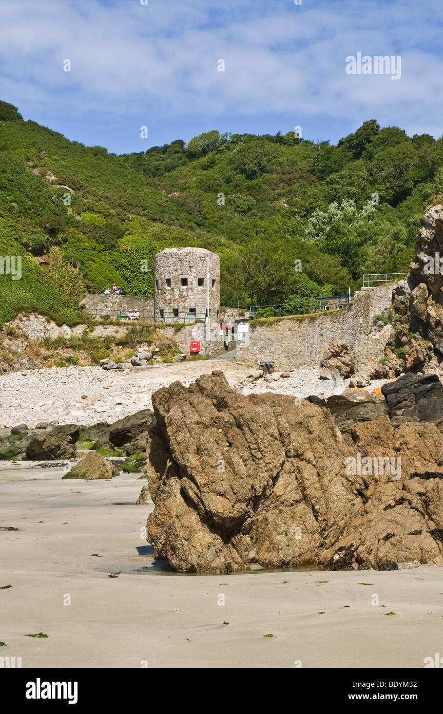 dh Petit Bot Bay FOREST GUERNSEY Seafront rocky beach bay and Loophole tower No13 18th Century defenses Stock Photo