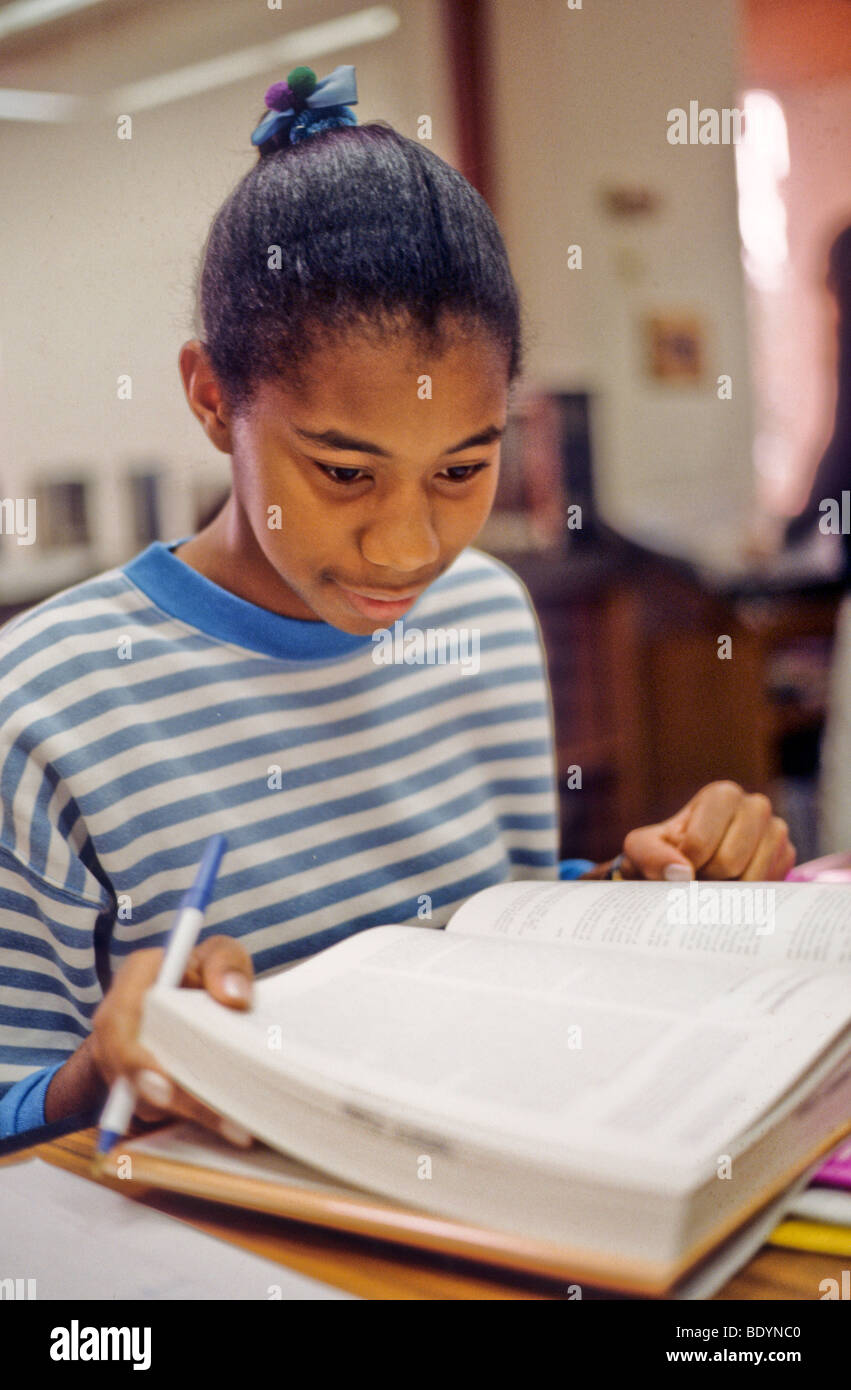 black female teen studies school work book Stock Photo - Alamy