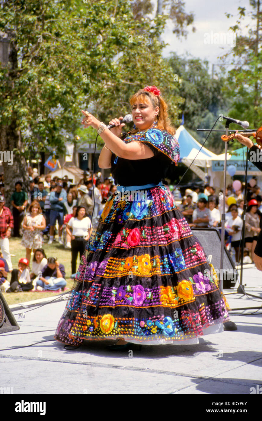 female sings at Cinco de Mayo fiesta Anaheim, California cultural