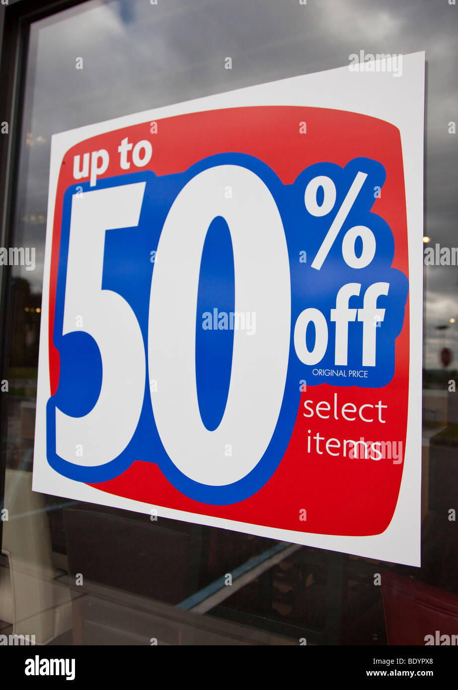 Fifty percent  discount sale in store window Stock Photo