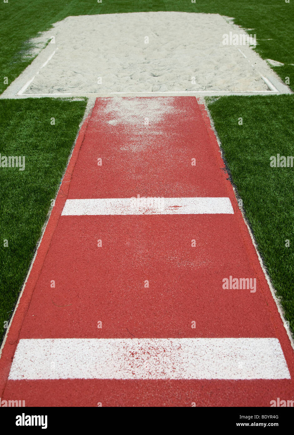 Runway and sand pit for a long jump Stock Photo - Alamy
