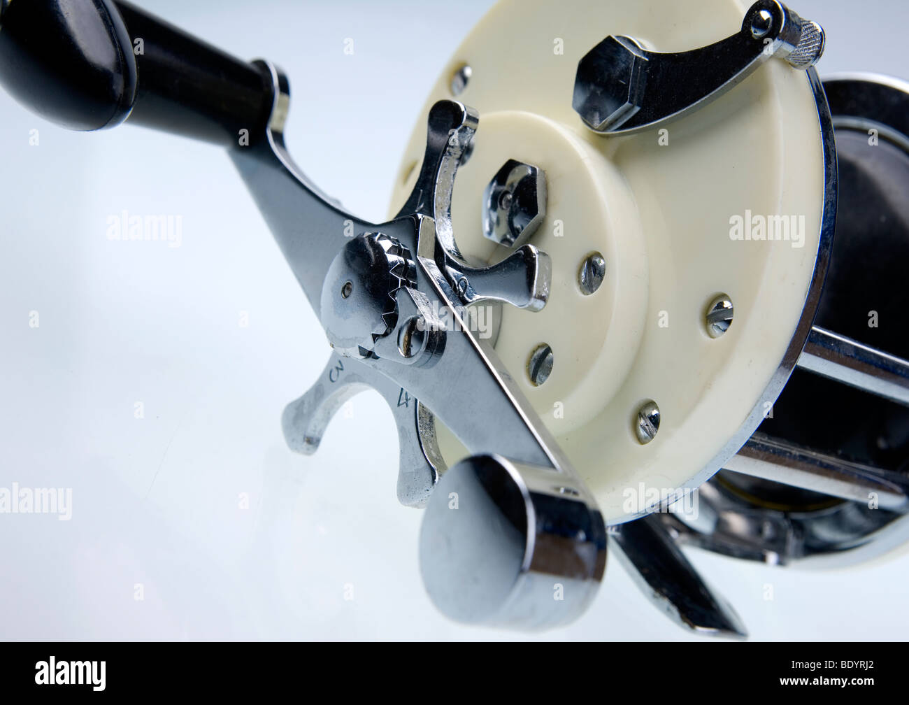 very clean old style fishing rod reel multiplier Stock Photo - Alamy