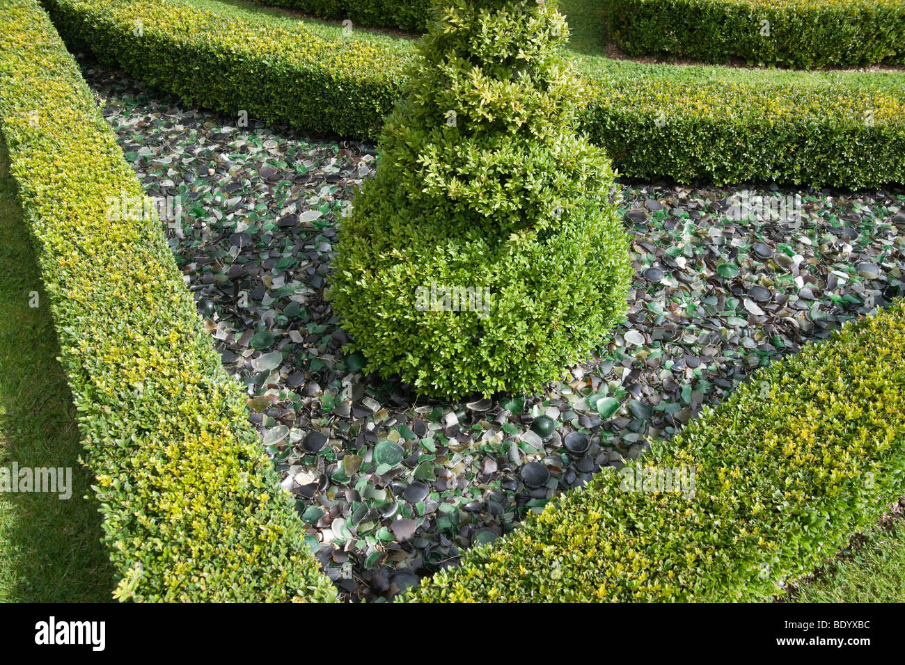 Broken glass used in garden design Stock Photo Alamy
