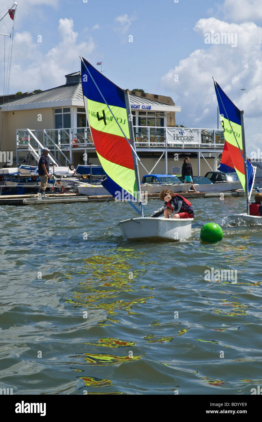 dh Harbour ST PETER PORT GUERNSEY Guernsey Yacht Club Children learning to sail in boating pond sailing yachts sport activity uk Stock Photo