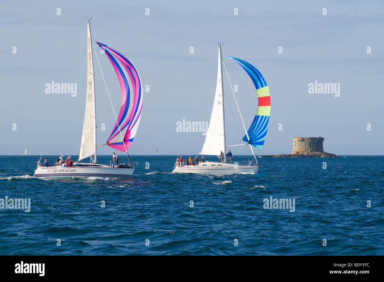 dh  YACHTING GUERNSEY Yachts sailing X-Celerator yacht Martello tower Guernseys watersport boats channel islands sailboat sea boat uk Stock Photo
