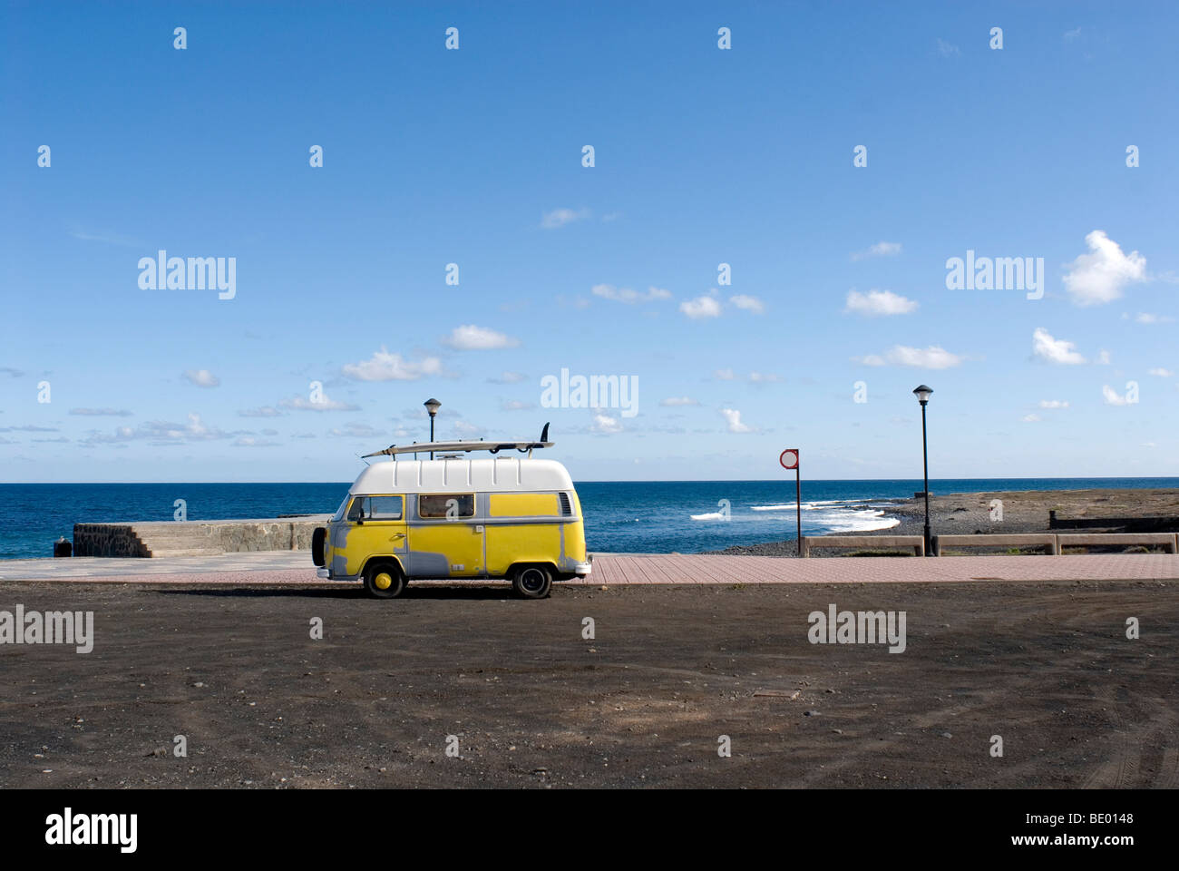 Camper van with surfboard in Pozo Izquierdo, Santa Lucia, Gran Canaria, Spain, Europe Stock Photo