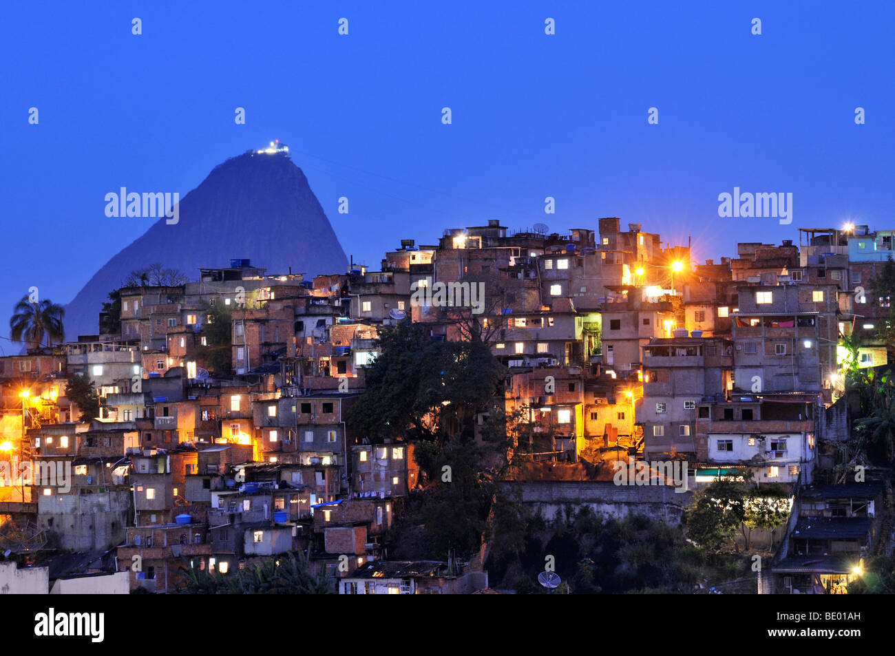 Favela, shanty town in front of Sugarloaf Mountain, Pão de Açúcar, Rio de Janeiro, Brazil, South America Stock Photo