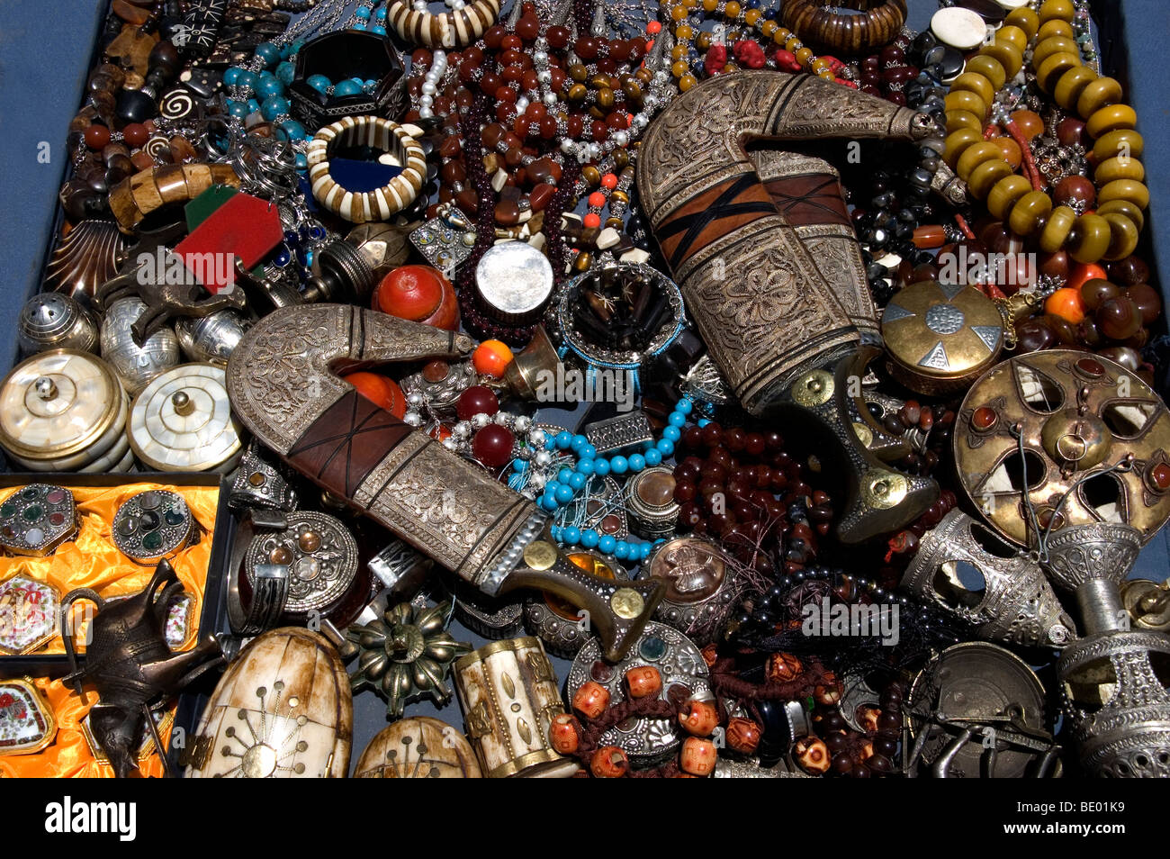 A box filled with traditional jewellery and antiques at an antiques store the old city of Sana'a in Yemen. Stock Photo