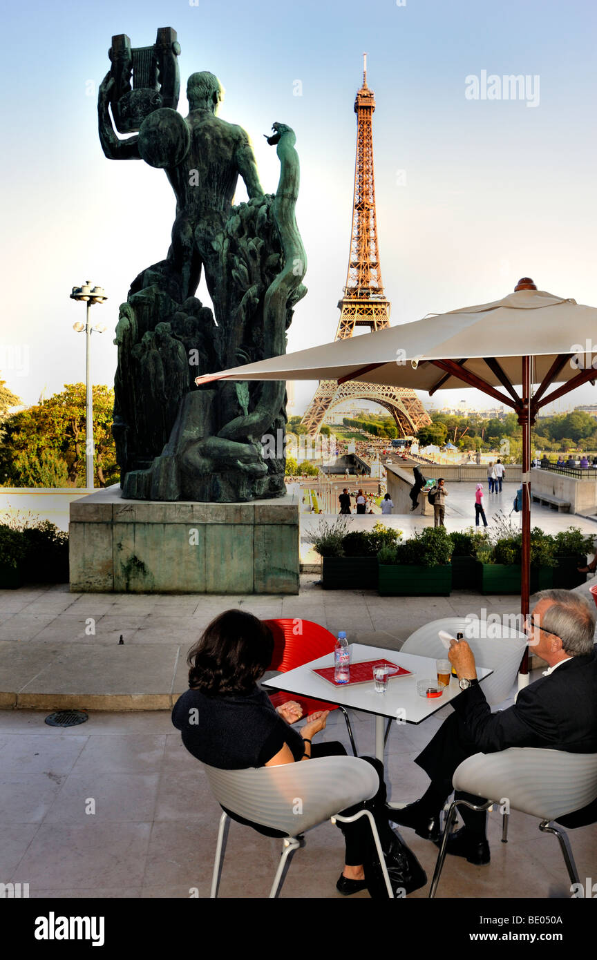 Paris, France, Couple in French Cafe/Bistro Restaurant, Sidewalk terrace in Trocadero, sculpture back Stock Photo