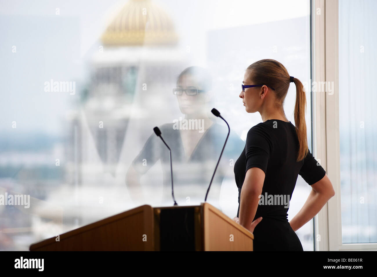 Woman in a conference room, with a view Stock Photo
