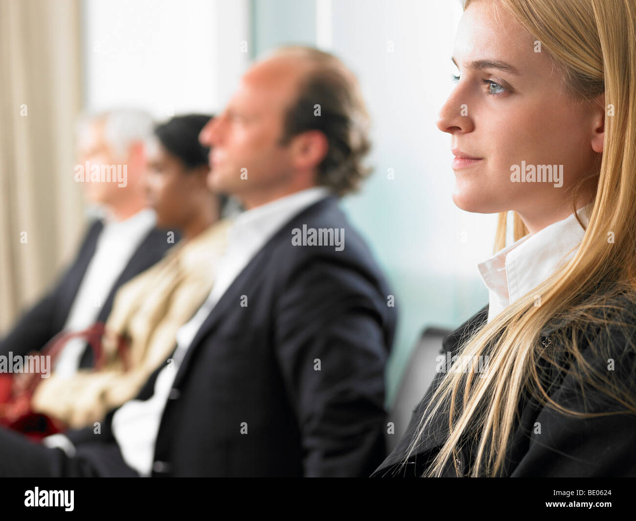 People sitting in a waiting room Stock Photo