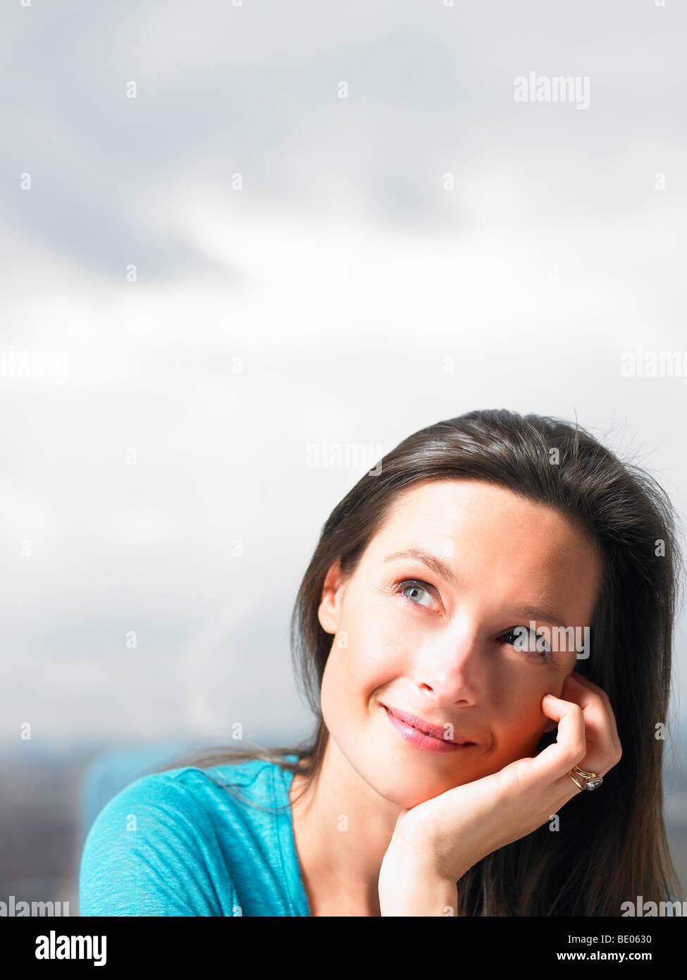 Business woman smiling and dreaming Stock Photo