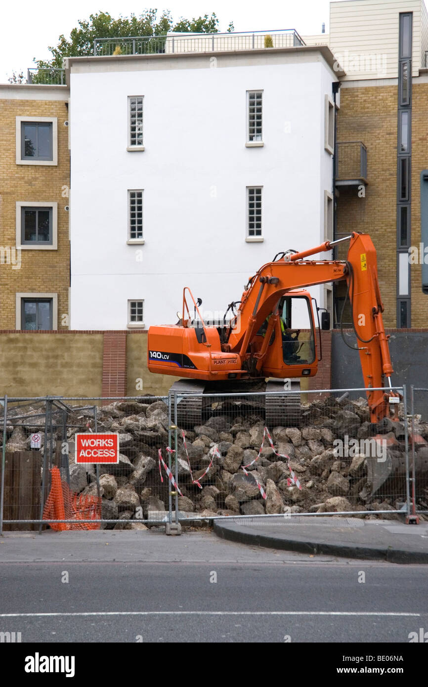 Excavator working on demolish site Stock Photo
