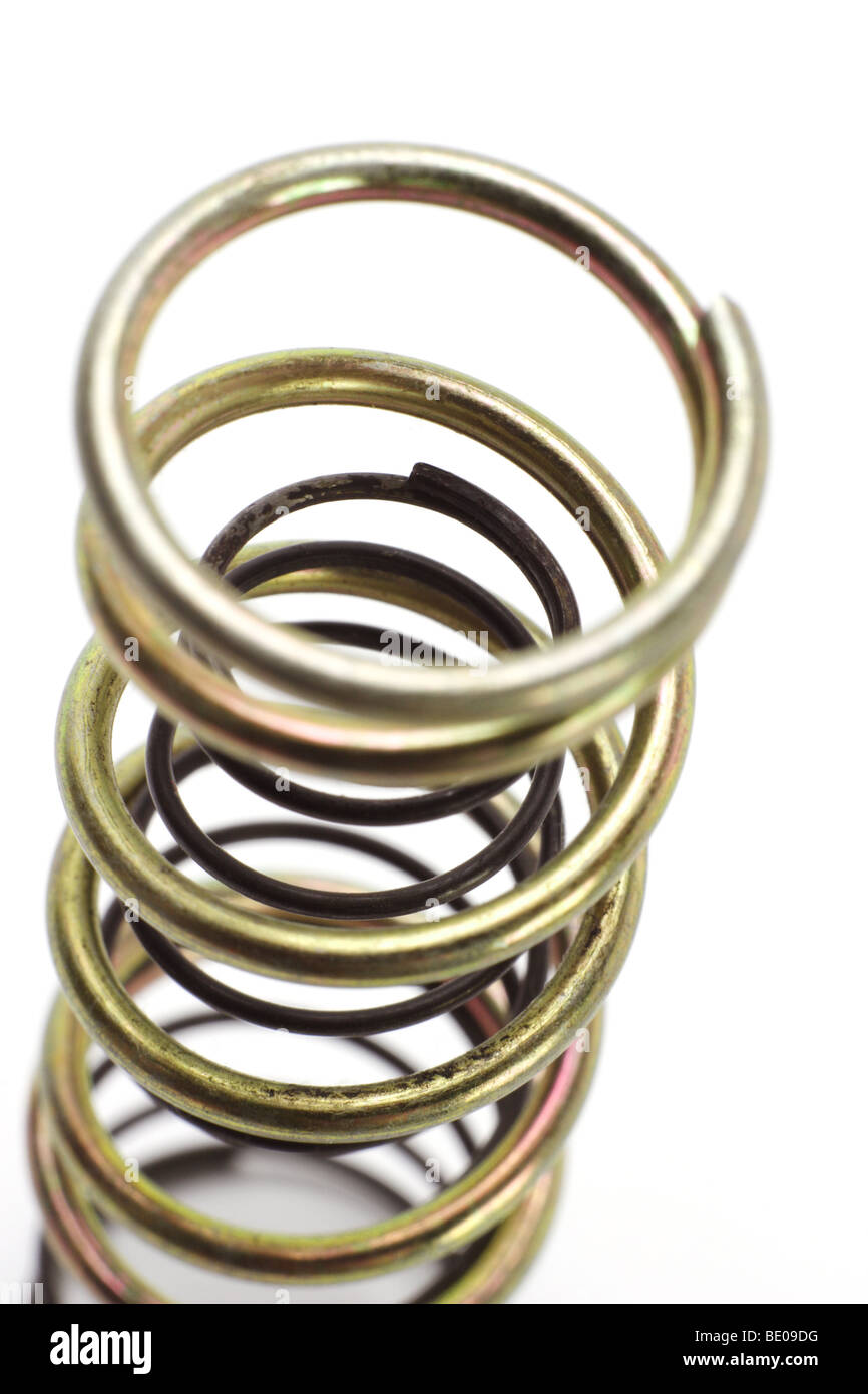 Metal spring coils arranged one inside another Stock Photo
