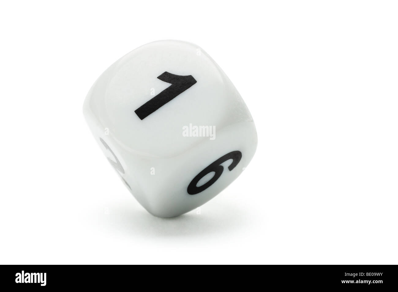 White dice with numbers 1 and 6 standing on white background with copy space Stock Photo