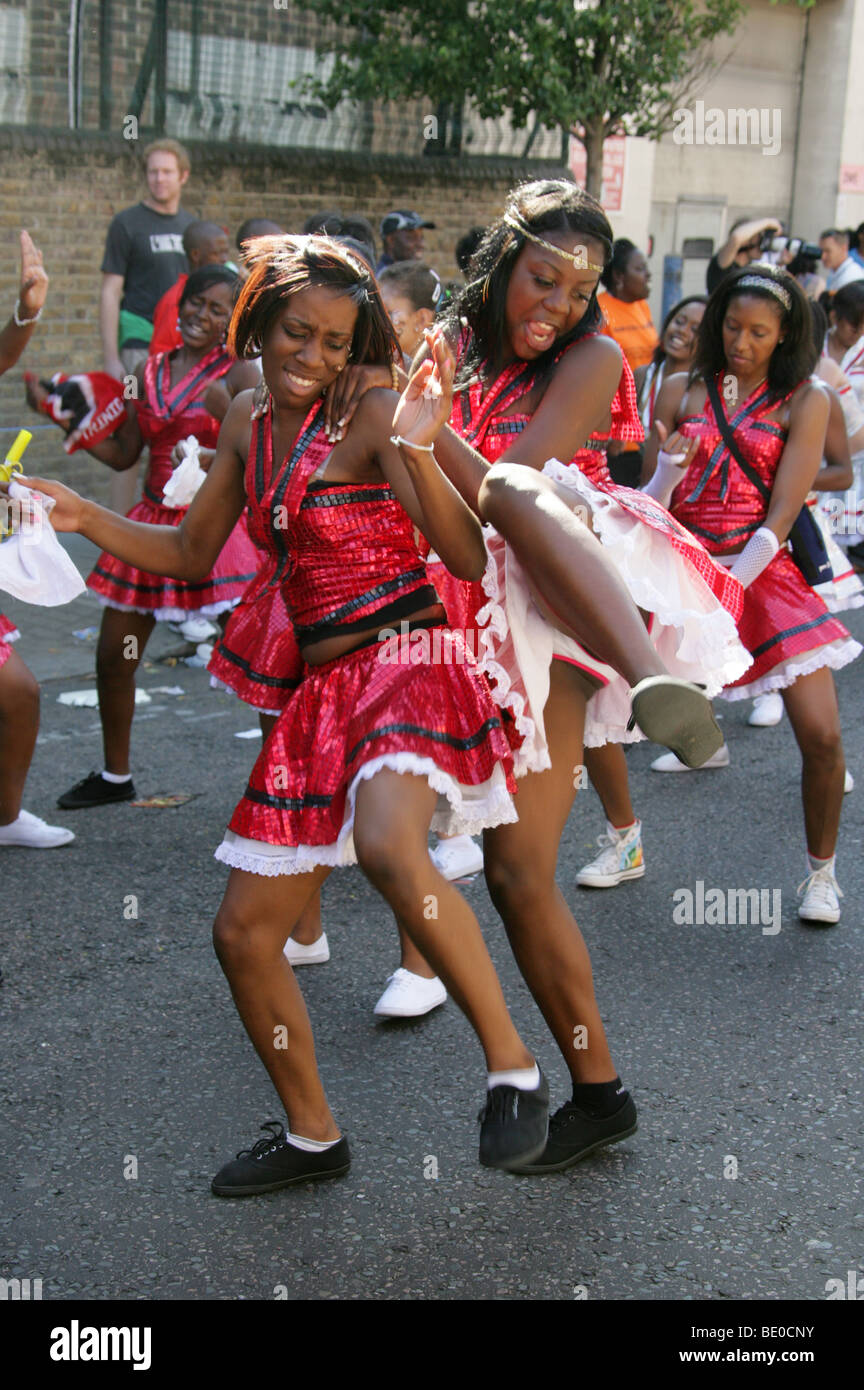 Young Caribbean Girls Having Fun Dancing in the Notting Hill Carnival Parade 2009 Stock Photo