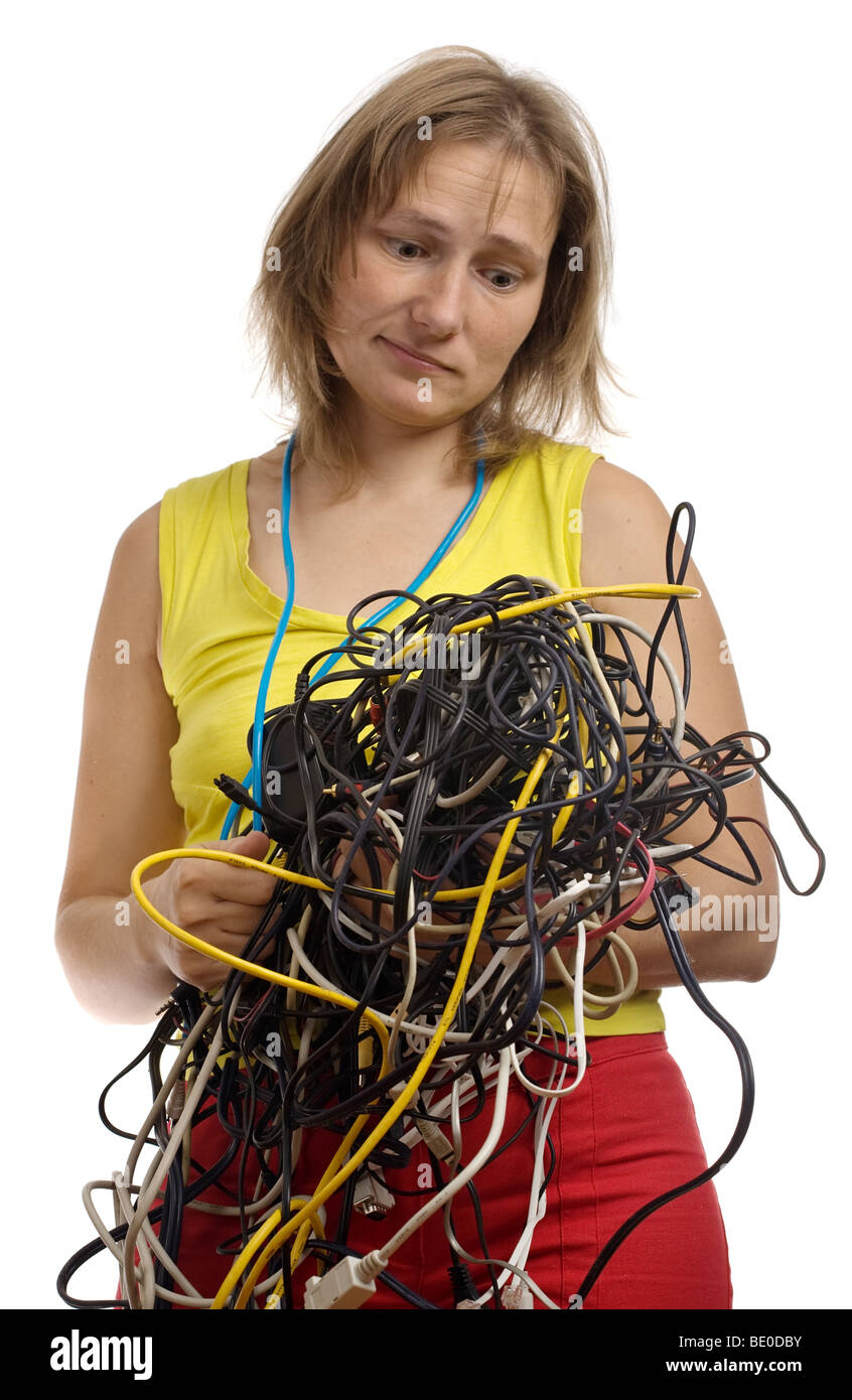 tired woman with tangle of cables and wires in hands isolated on white