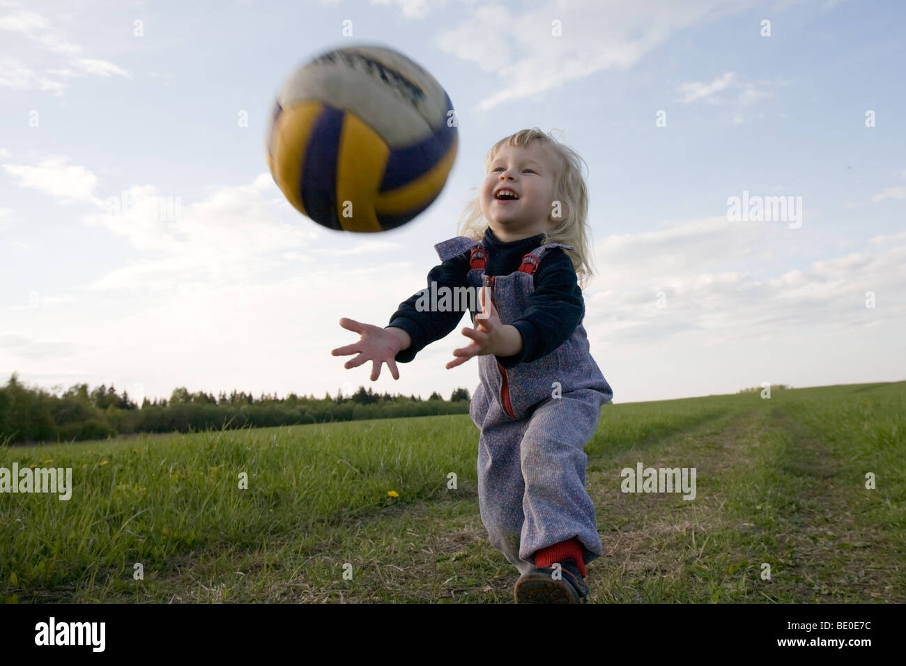 Child Catching A Ball