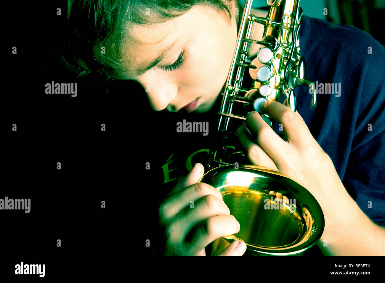 Young boy playing saxophone Stock Photo