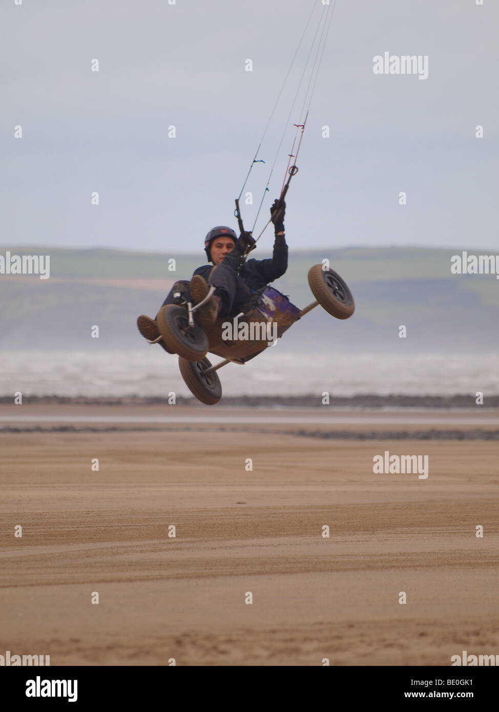 Parakarter / kite buggying doing aerial trick, Westward Ho!, Devon, UK Stock Photo Alamy