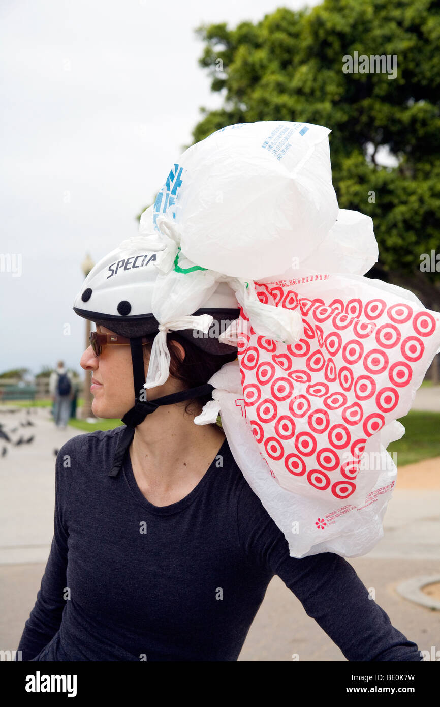 Woman with plastic bag hat. Santa Monica, California, USA Stock Photo