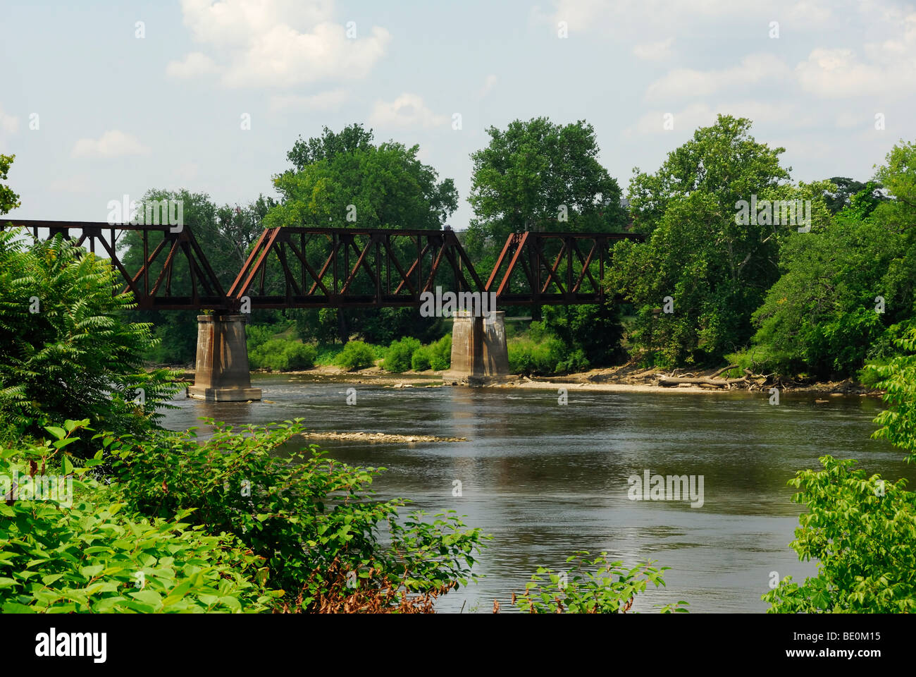 railroad trestle bridge over Muskingum river Zanesville Ohio Stock Photo